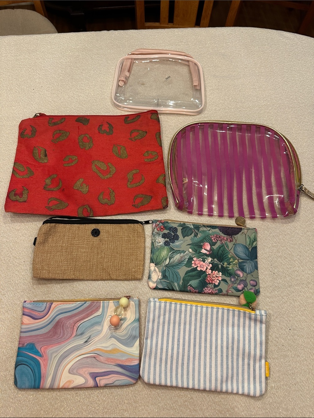 Assorted cosmetic bags including IPSY and MudPie